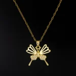 Premium gold plated butterfly pendant necklace on black background