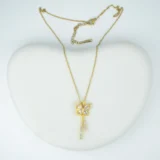 Butterfly gold pendant necklace with cubic zirconia stones and tassel design