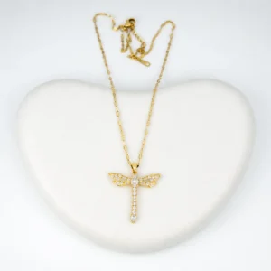 Close-up view of dragonfly gold pendant necklace with diamond stones