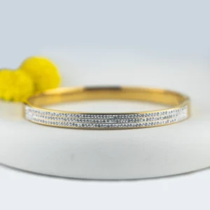 Diamond studded bangle for women made with anti tarnish stainless steel in gold finish