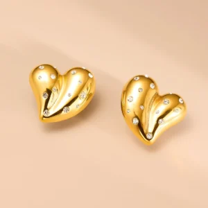 gold heart earrings for women close view